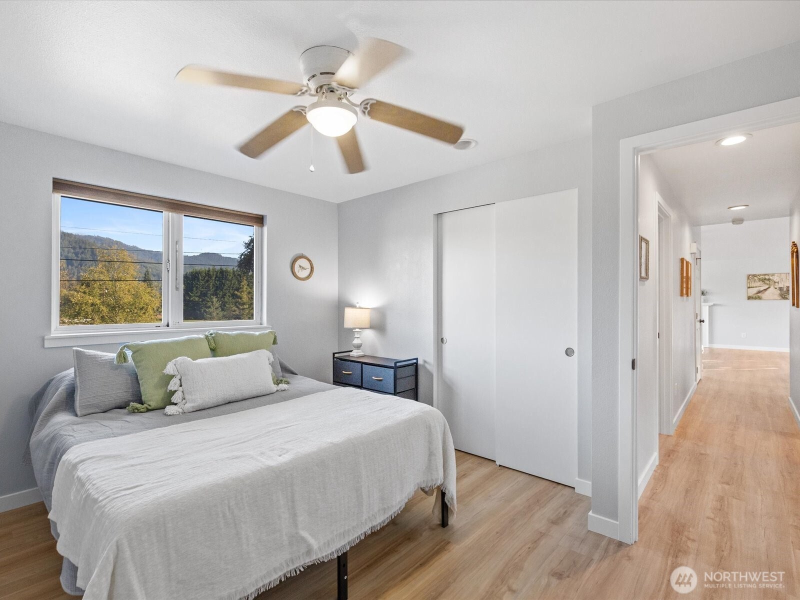 13802 State Rte 530 Northeast Arlington, WA 98223 - Photo 23 of 40 a bedroom with a large bed and a window