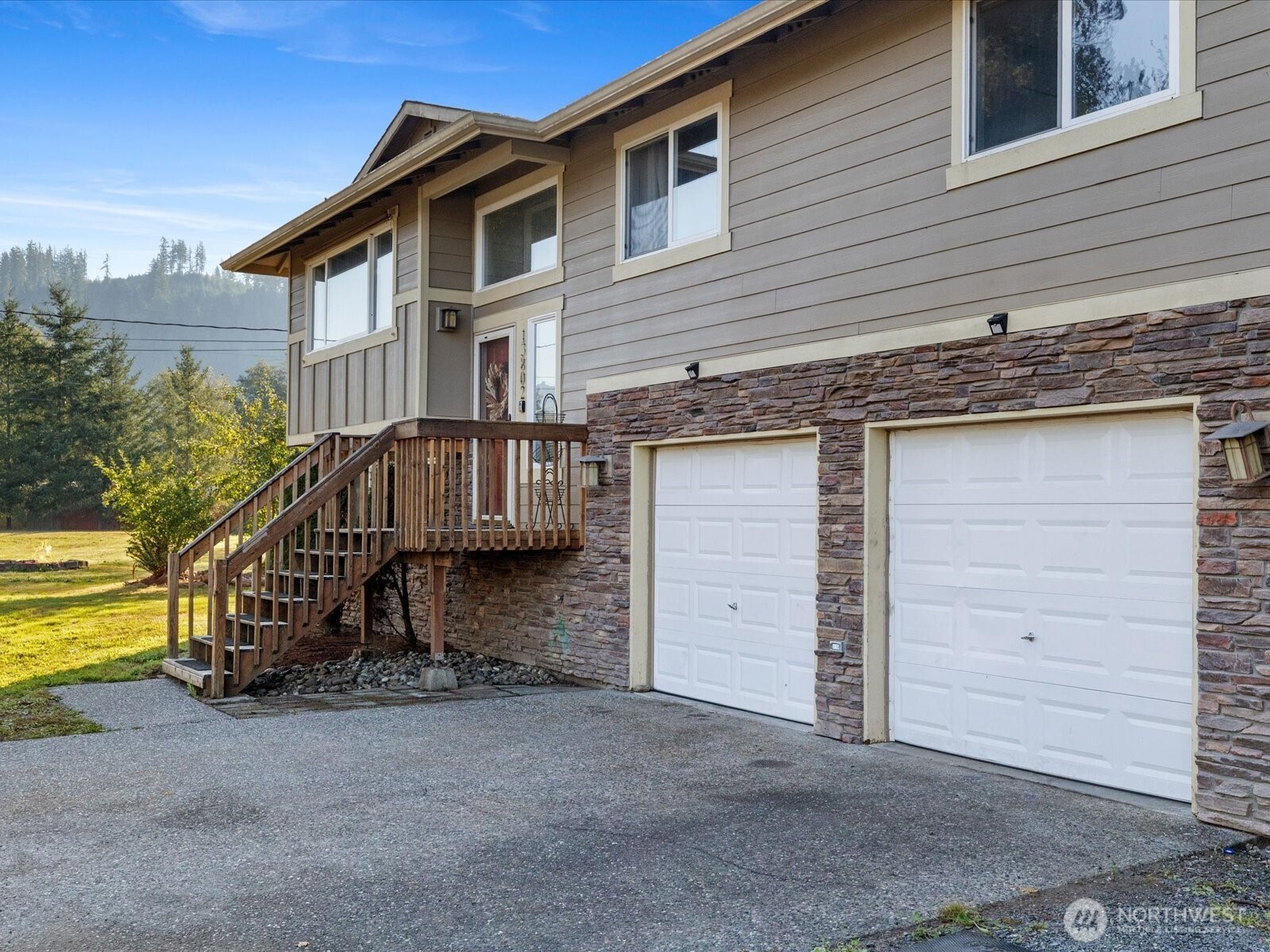 13802 State Rte 530 Northeast Arlington, WA 98223 - Photo 3 of 40 a front view of a house with a yard