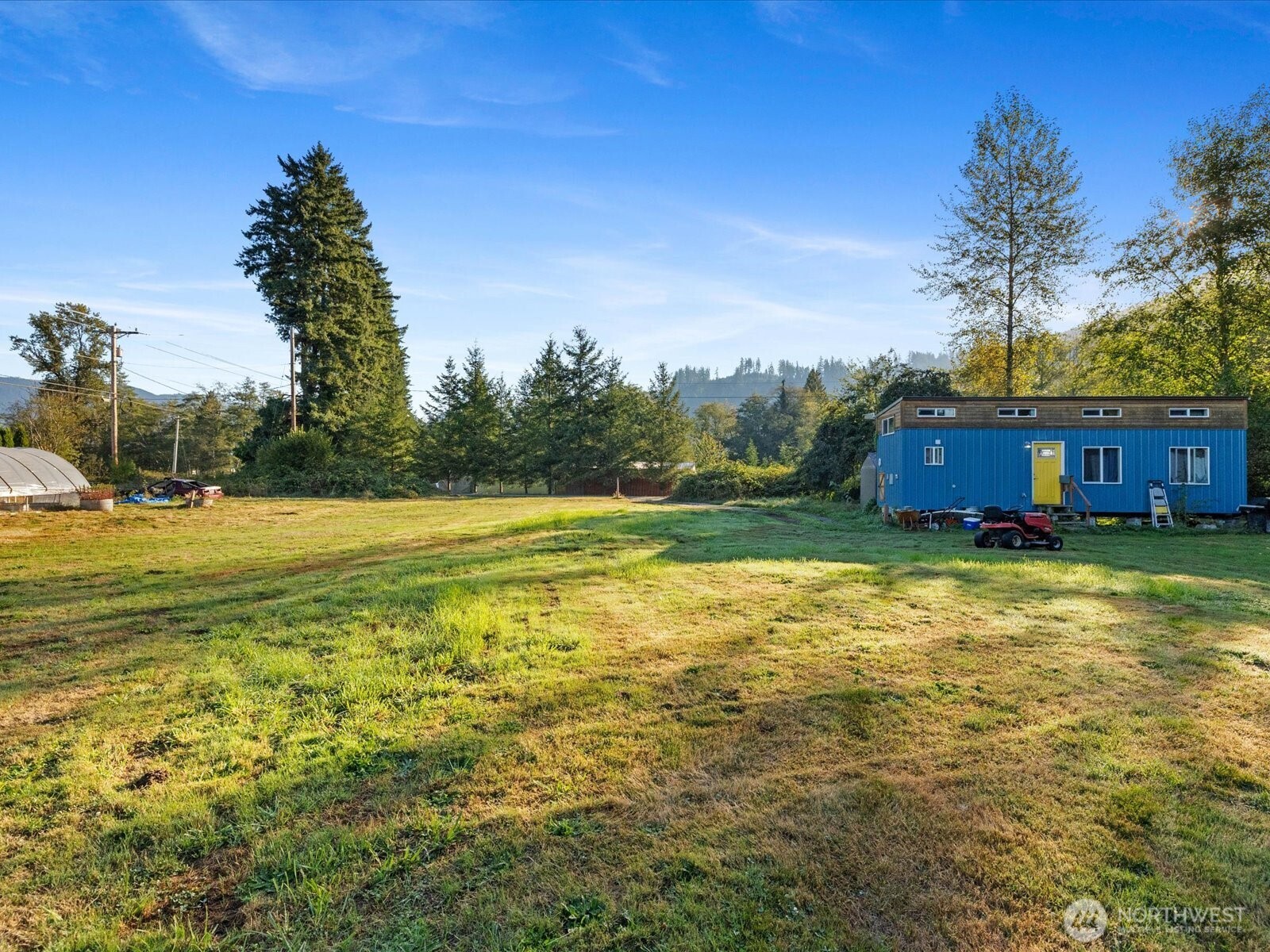 13802 State Rte 530 Northeast Arlington, WA 98223 - Photo 33 of 40 a view of a swimming pool with an outdoor space and seating area