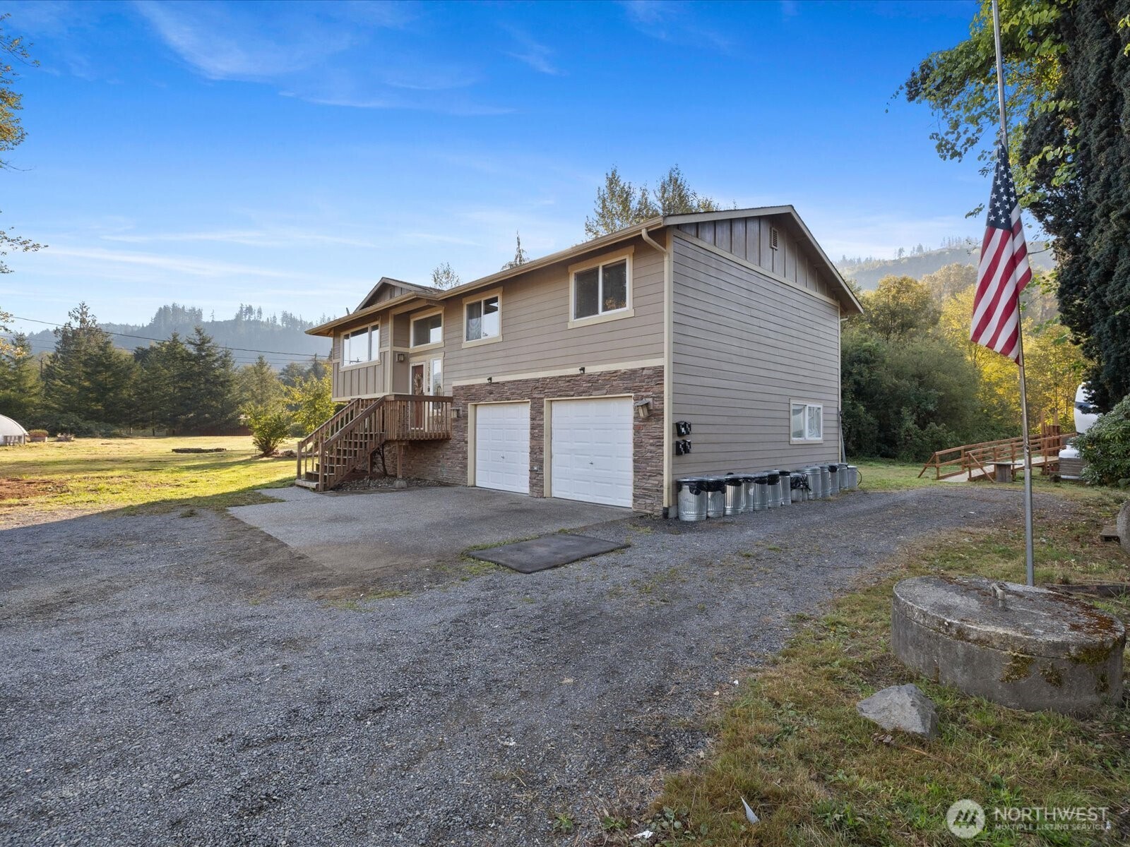 13802 State Rte 530 Northeast Arlington, WA 98223 - Photo 36 of 40 a view of a house with backyard and a tree