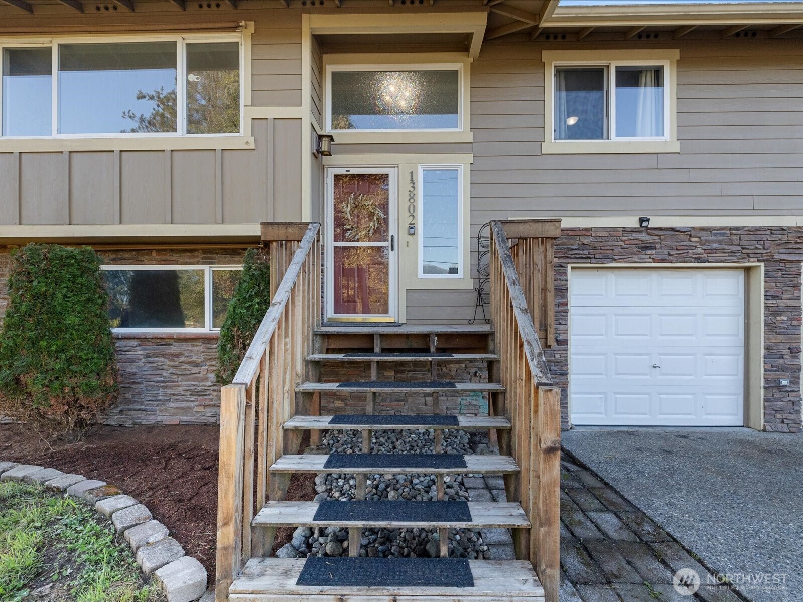13802 State Rte 530 Northeast Arlington, WA 98223 - Photo 4 of 40 a front view of a house with stairs