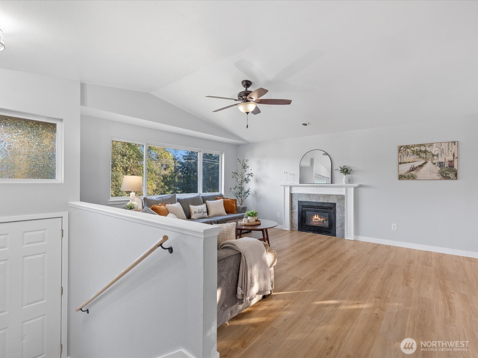 13802 State Rte 530 Northeast Arlington, WA 98223 - Photo 7 of 40 a view of a kitchen with a sink a fireplace and a chandelier fan