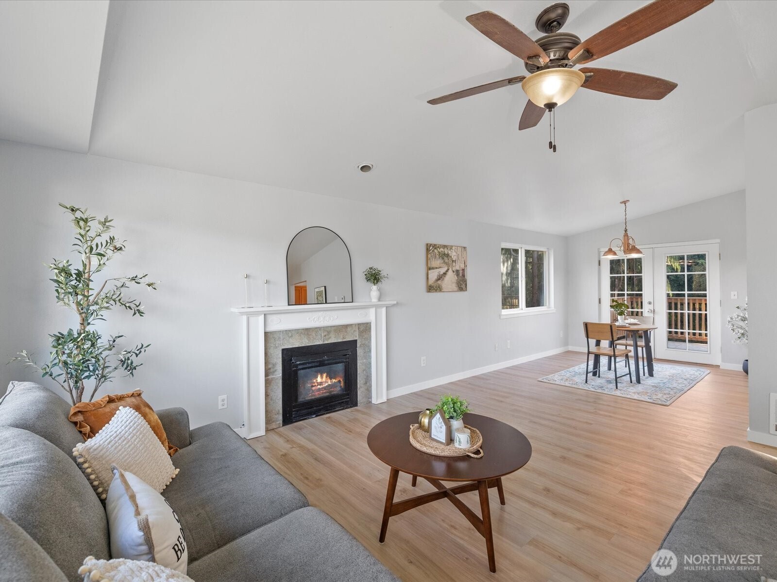13802 State Rte 530 Northeast Arlington, WA 98223 - Photo 10 of 40 a living room with furniture and a fireplace