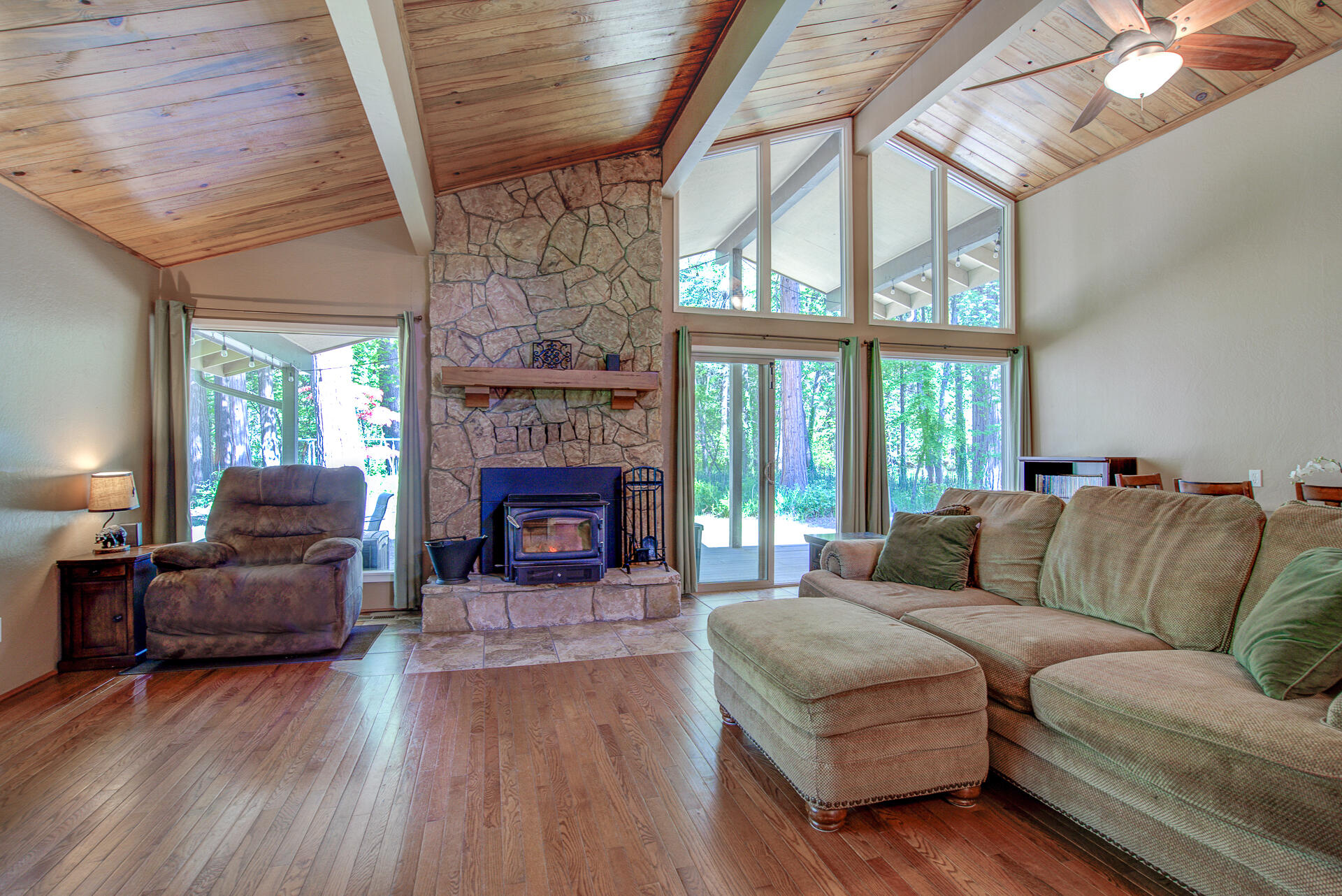 12 Billys Peak Road Trinity Center, CA 96091 - Photo 3 of 52 a living room with furniture a fireplace and a large window