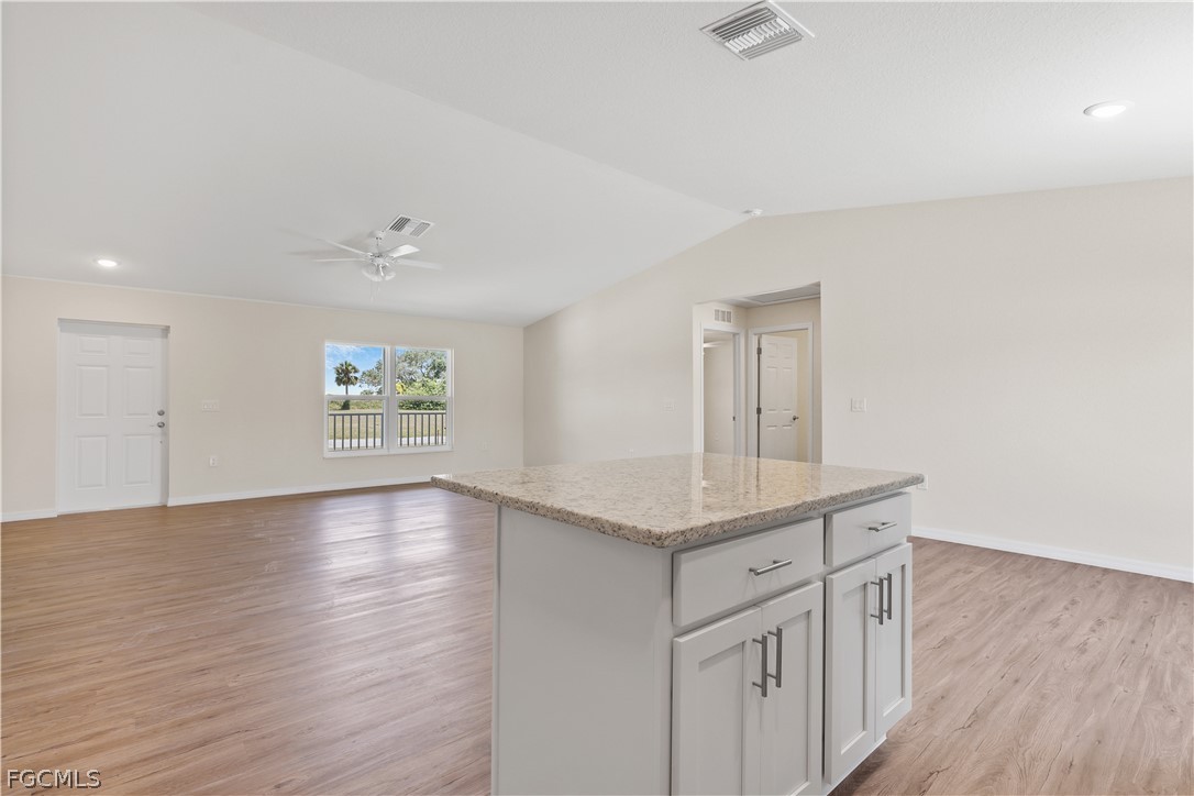 4524 Springview Circle LaBelle, FL 33935 - Photo 12 of 25 a view with cabinets counter space and wooden floor