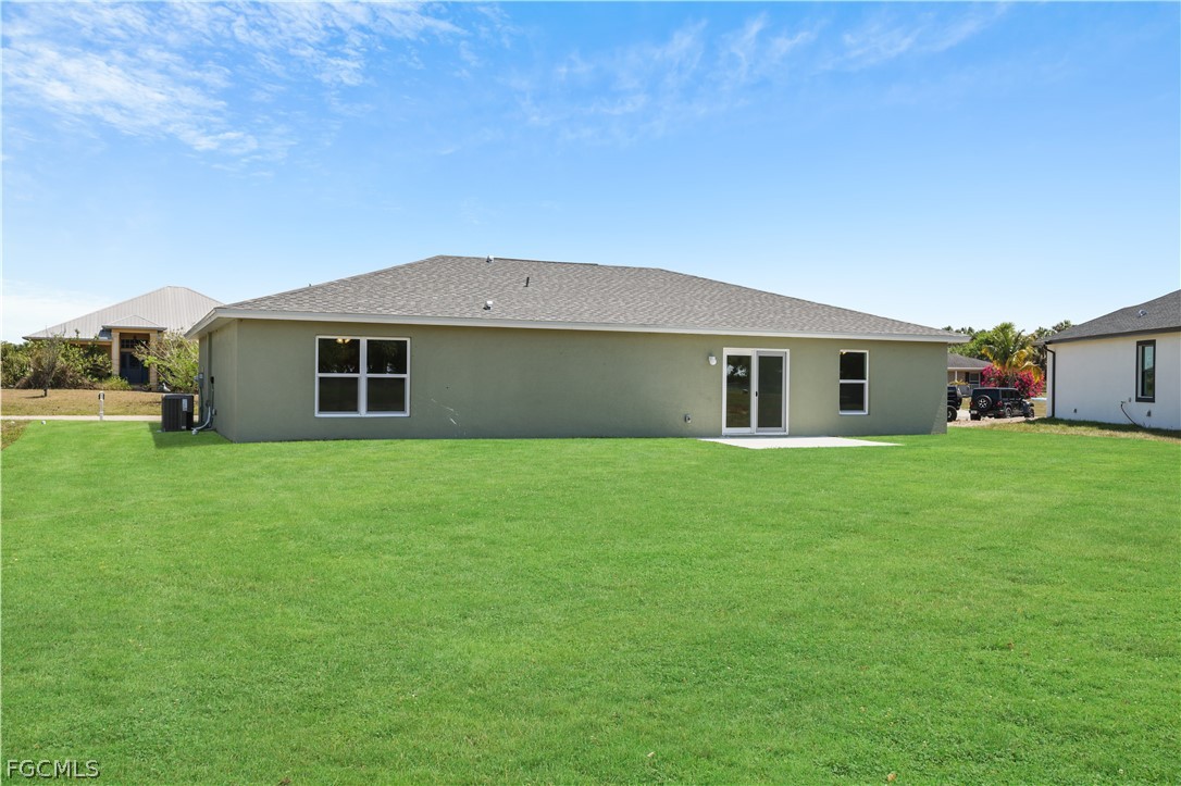 4524 Springview Circle LaBelle, FL 33935 - Photo 24 of 25 a front view of house with a garden