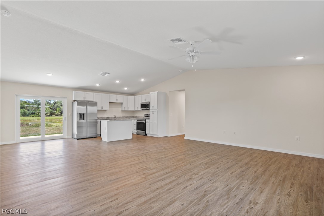 4524 Springview Circle LaBelle, FL 33935 - Photo 3 of 25 a view of a kitchen with wooden floor and a window