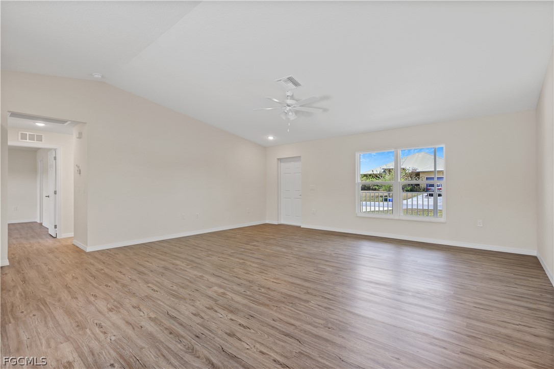 4524 Springview Circle LaBelle, FL 33935 - Photo 4 of 25 a view of an empty room with a window and wooden floor