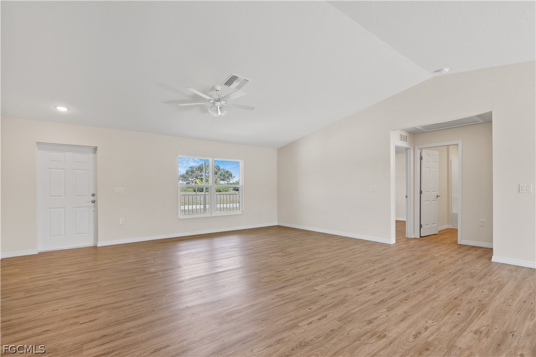 4524 Springview Circle LaBelle, FL 33935 - Photo 6 of 25 an empty room with wooden floor and windows