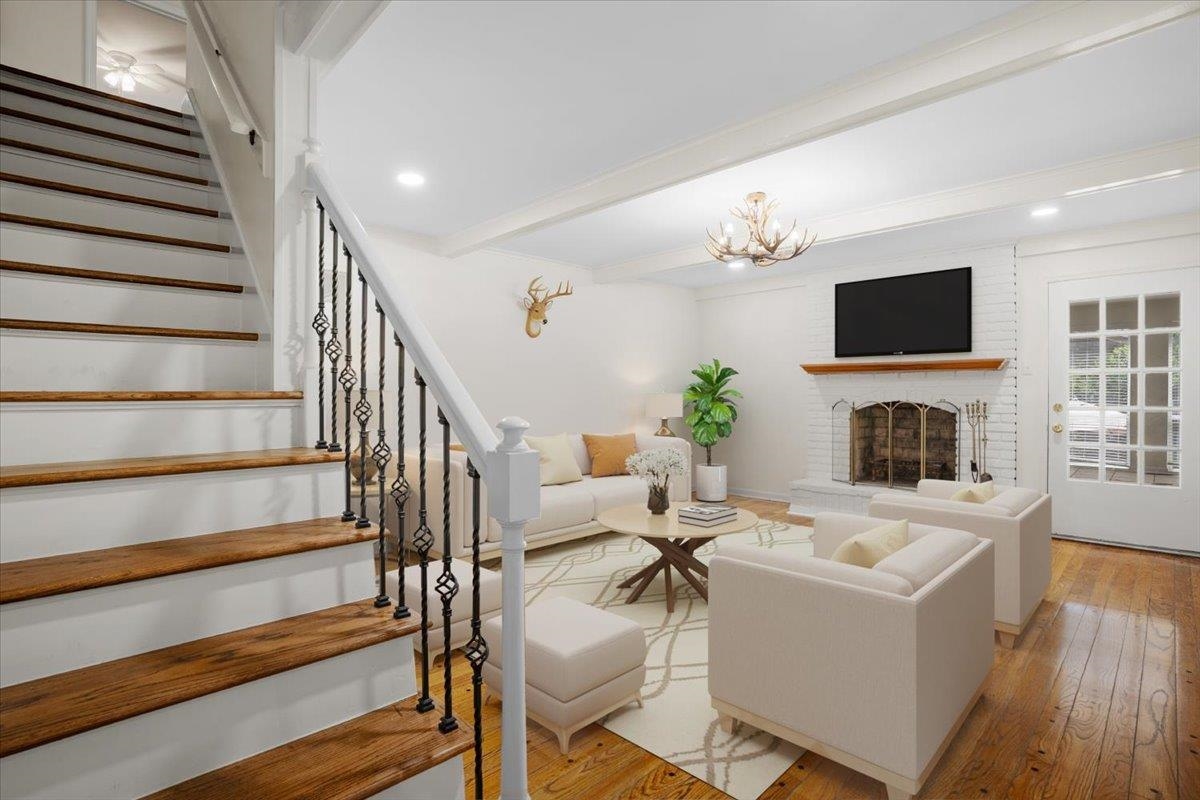 5639 Glade View Drive Memphis, TN 38120 - Photo 11 of 39 a living room with fireplace furniture and a flat screen tv