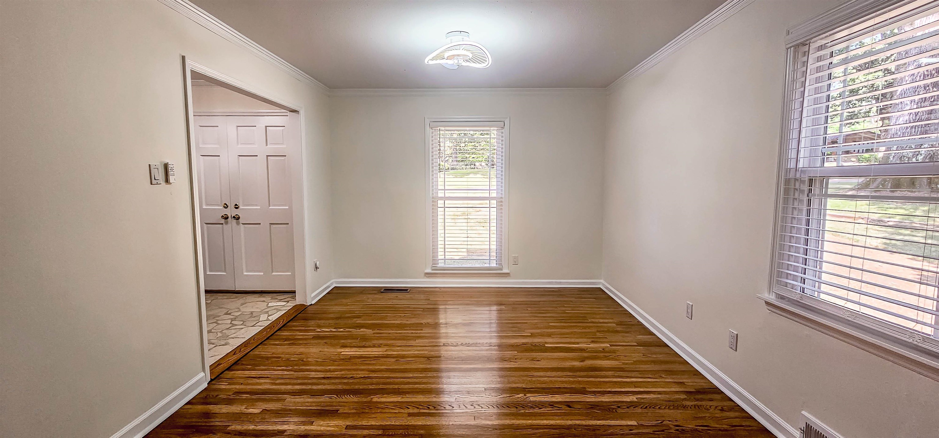 5639 Glade View Drive Memphis, TN 38120 - Photo 19 of 39 wooden floor in an empty room with a window
