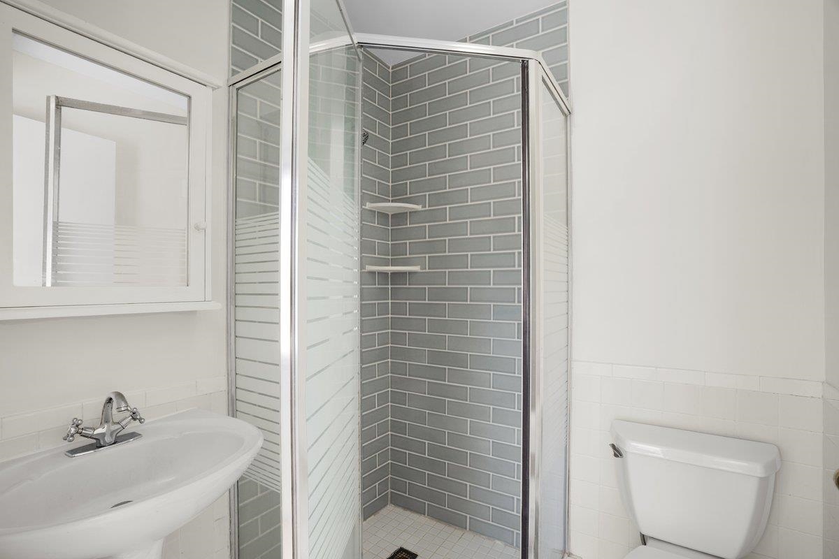 5639 Glade View Drive Memphis, TN 38120 - Photo 22 of 39 a bathroom with a shower and a sink