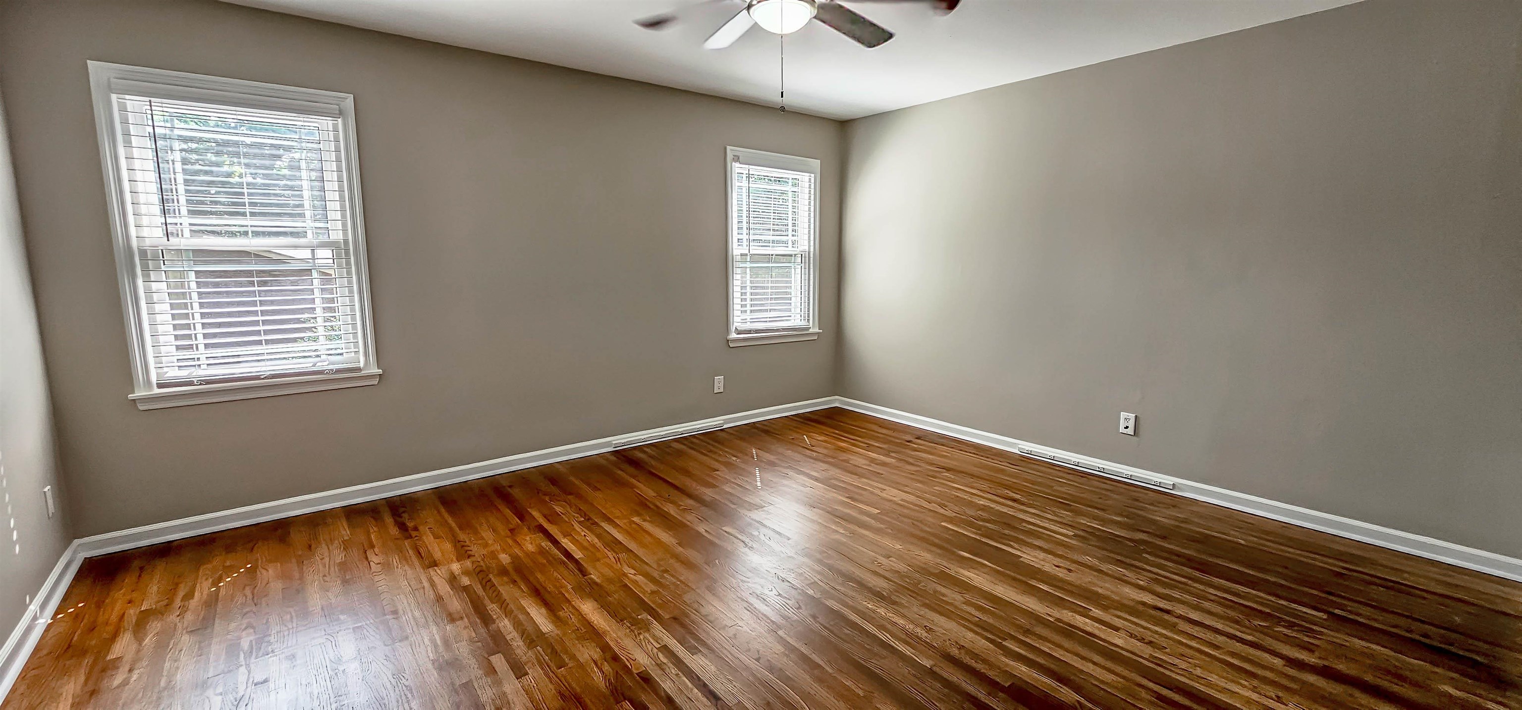5639 Glade View Drive Memphis, TN 38120 - Photo 28 of 39 a view of empty room with wooden floor and fan