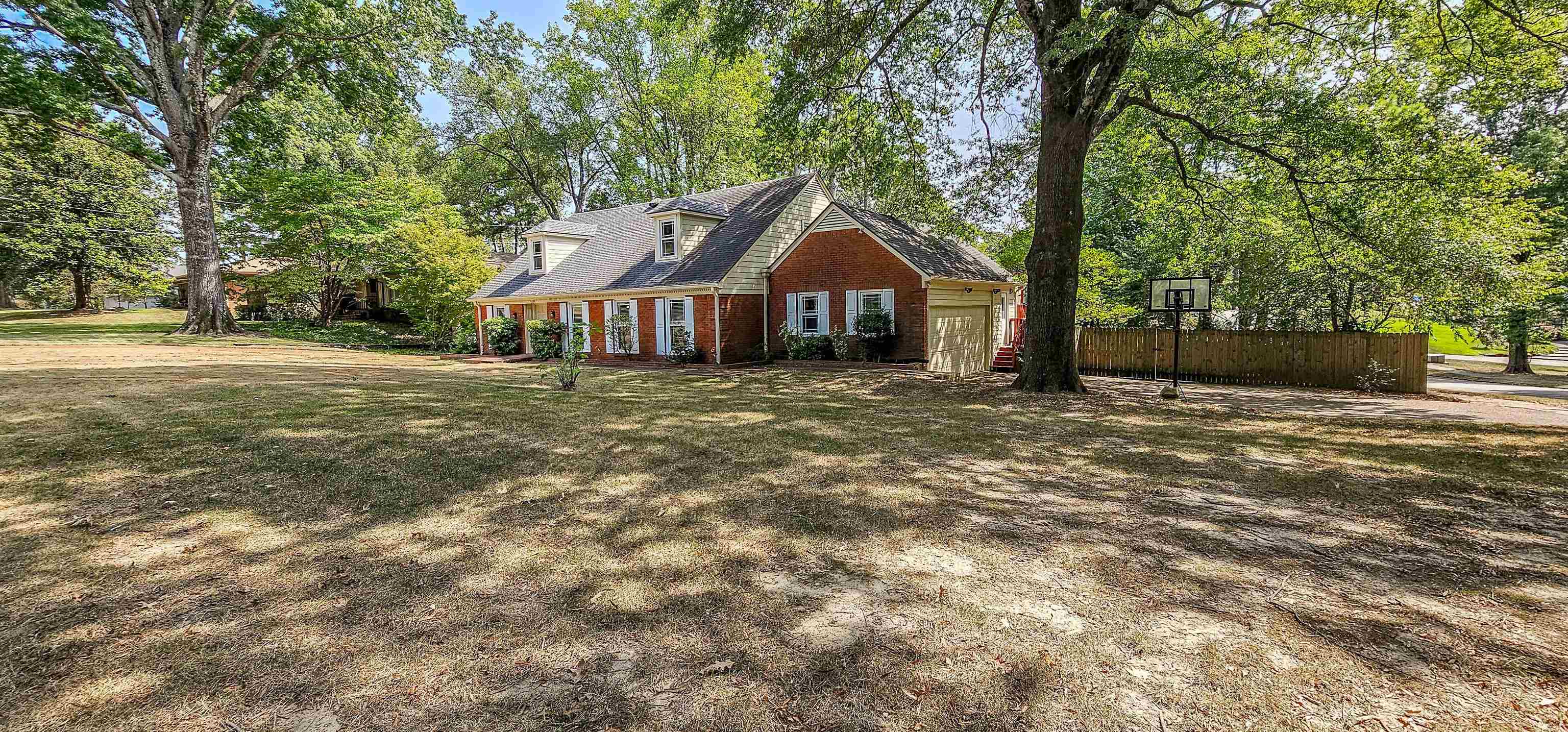 5639 Glade View Drive Memphis, TN 38120 - Photo 37 of 39 a front view of a house with a yard