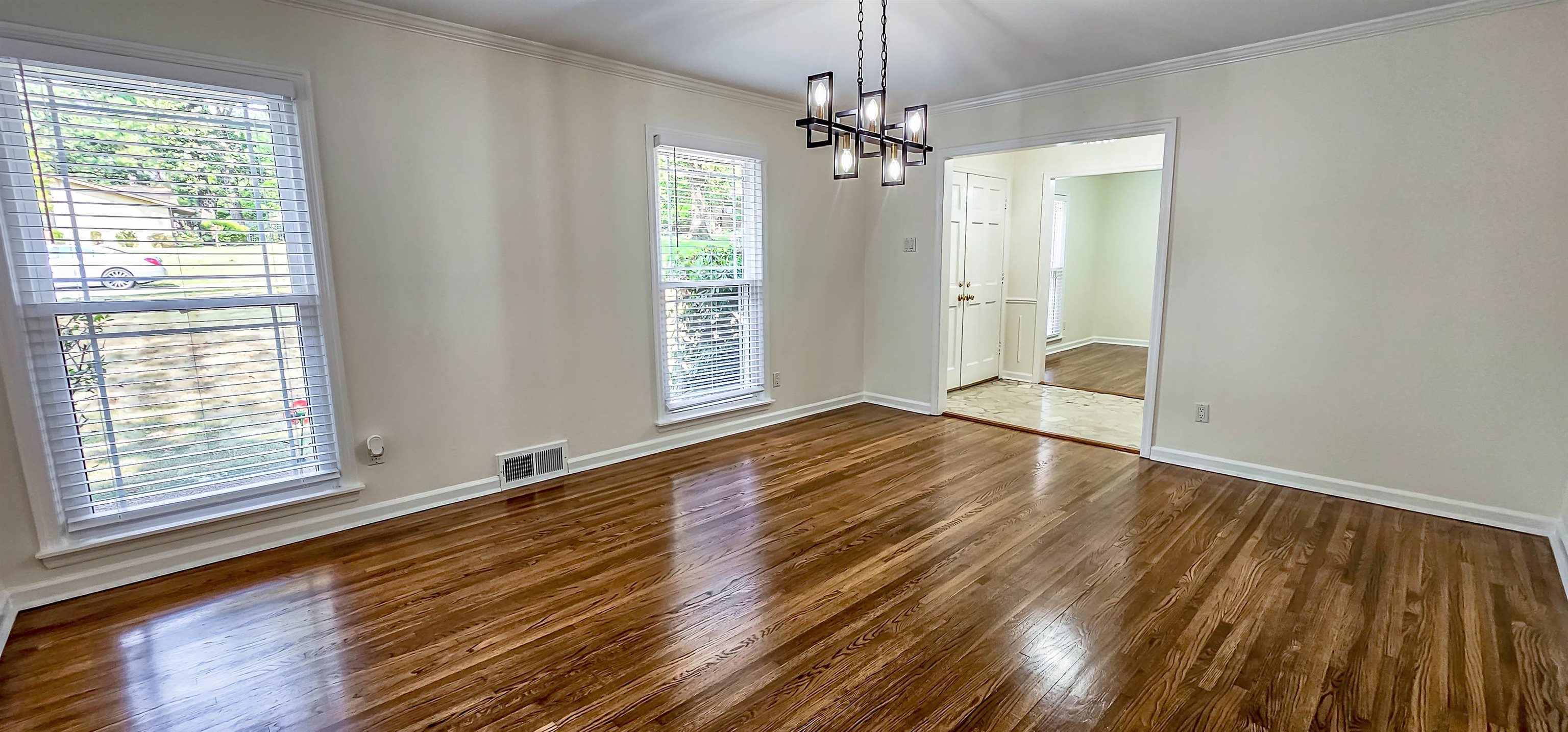 5639 Glade View Drive Memphis, TN 38120 - Photo 5 of 39 a view of empty room with wooden floor and fan