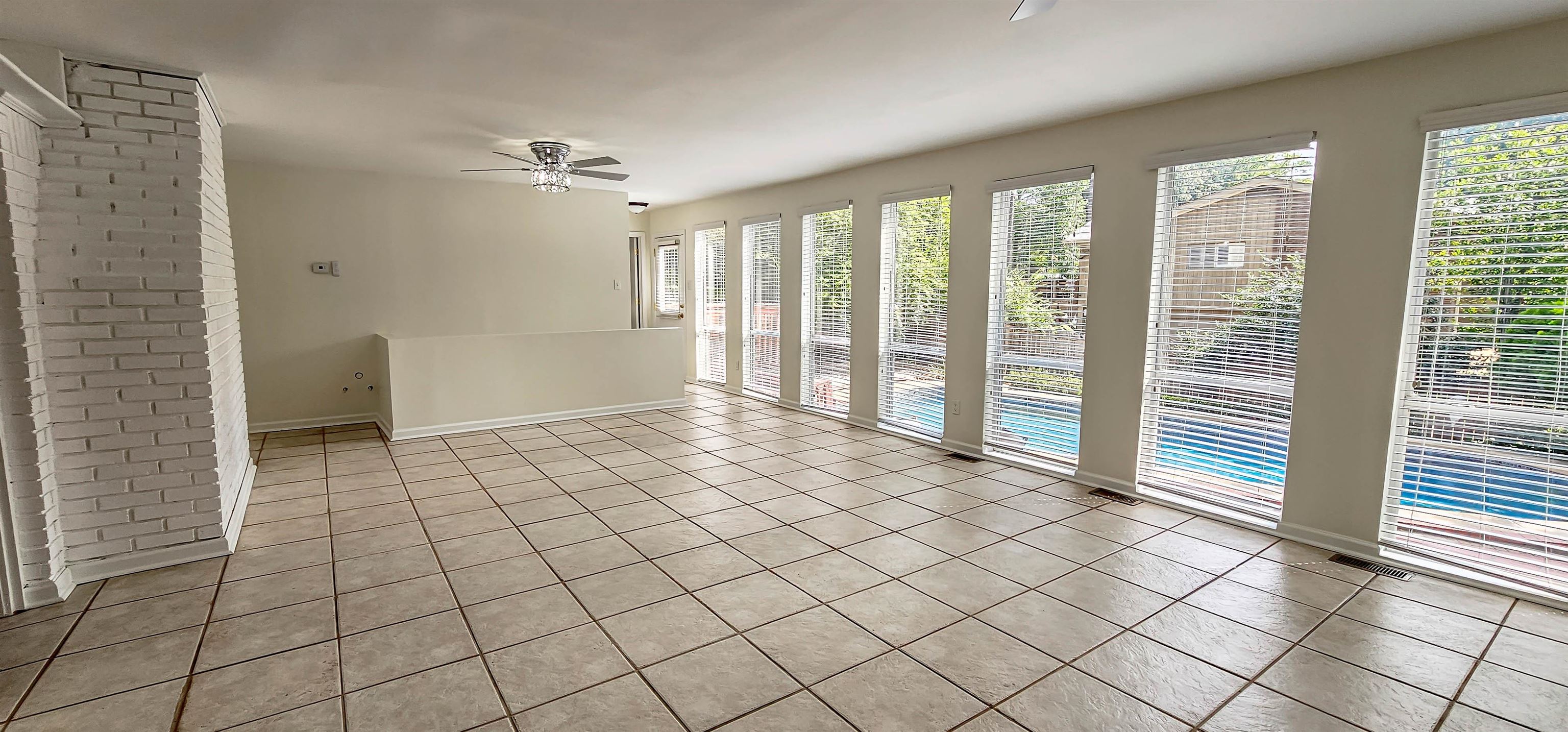 5639 Glade View Drive Memphis, TN 38120 - Photo 9 of 39 a view of empty room with wooden floor and fan