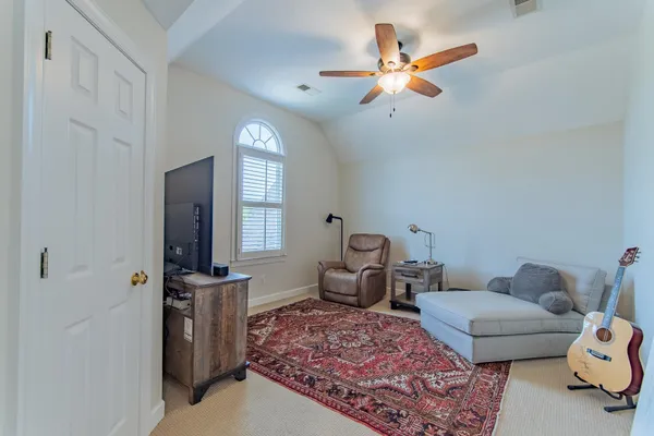 a living room with furniture and a window