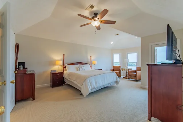 a bedroom with bed and window