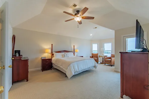 a bedroom with bed and window