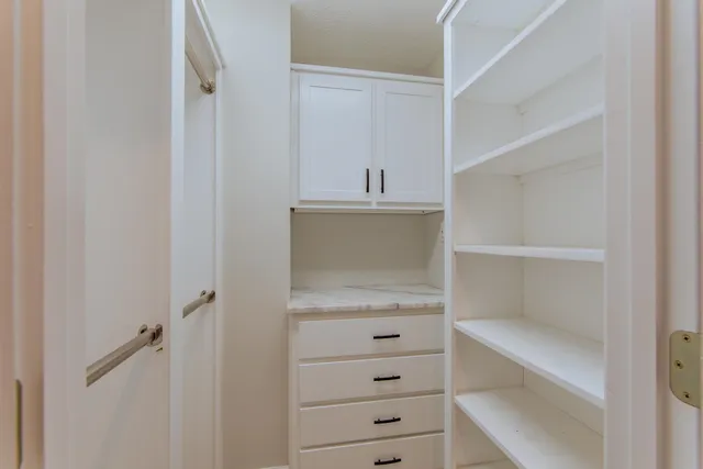 a view of an empty walk in closet