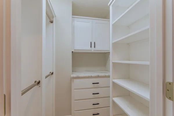 a view of an empty walk in closet