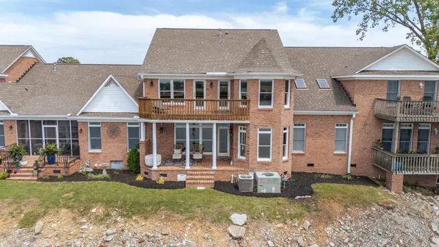 a view of a house with a yard and sitting area