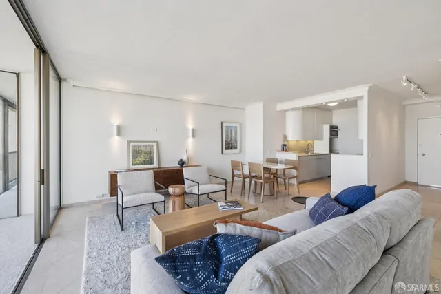 a balcony with furniture and a potted plant