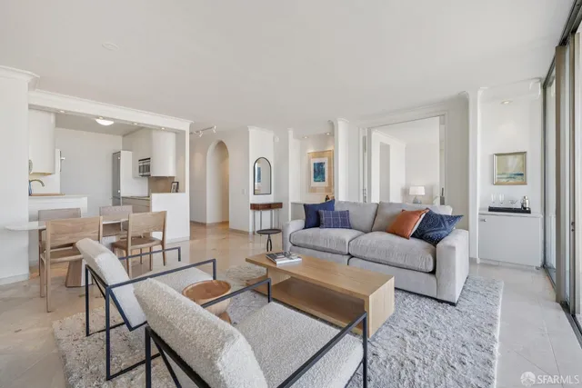 a living room with furniture and a table