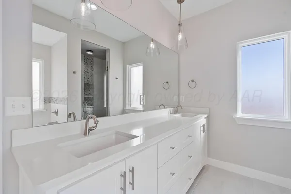 a white bath tub sitting next to a shower