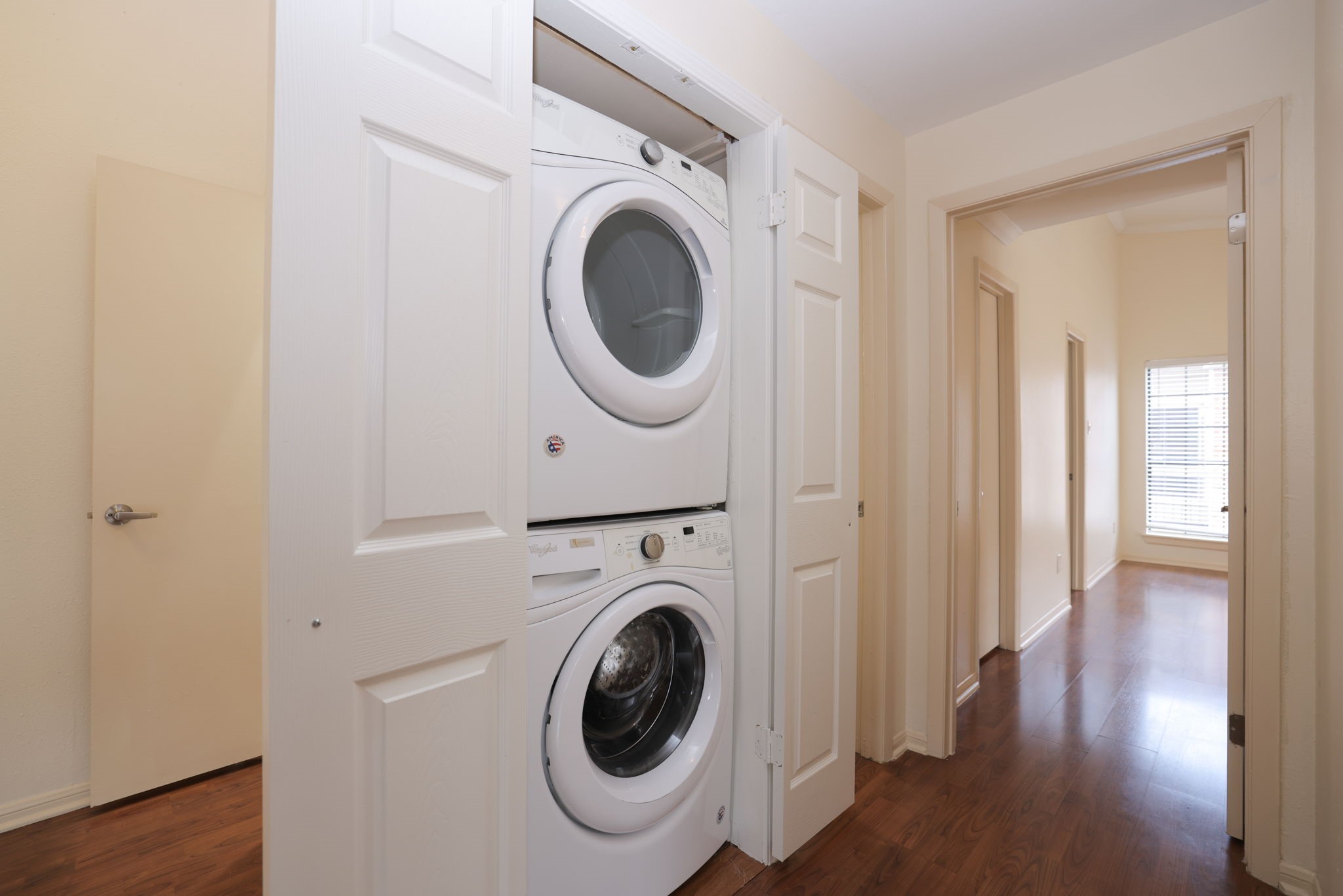 2001 Bering Drive, Unit 2F Houston, TX 77057 - Photo 21 of 32 a view of a hallway with washer and dryer