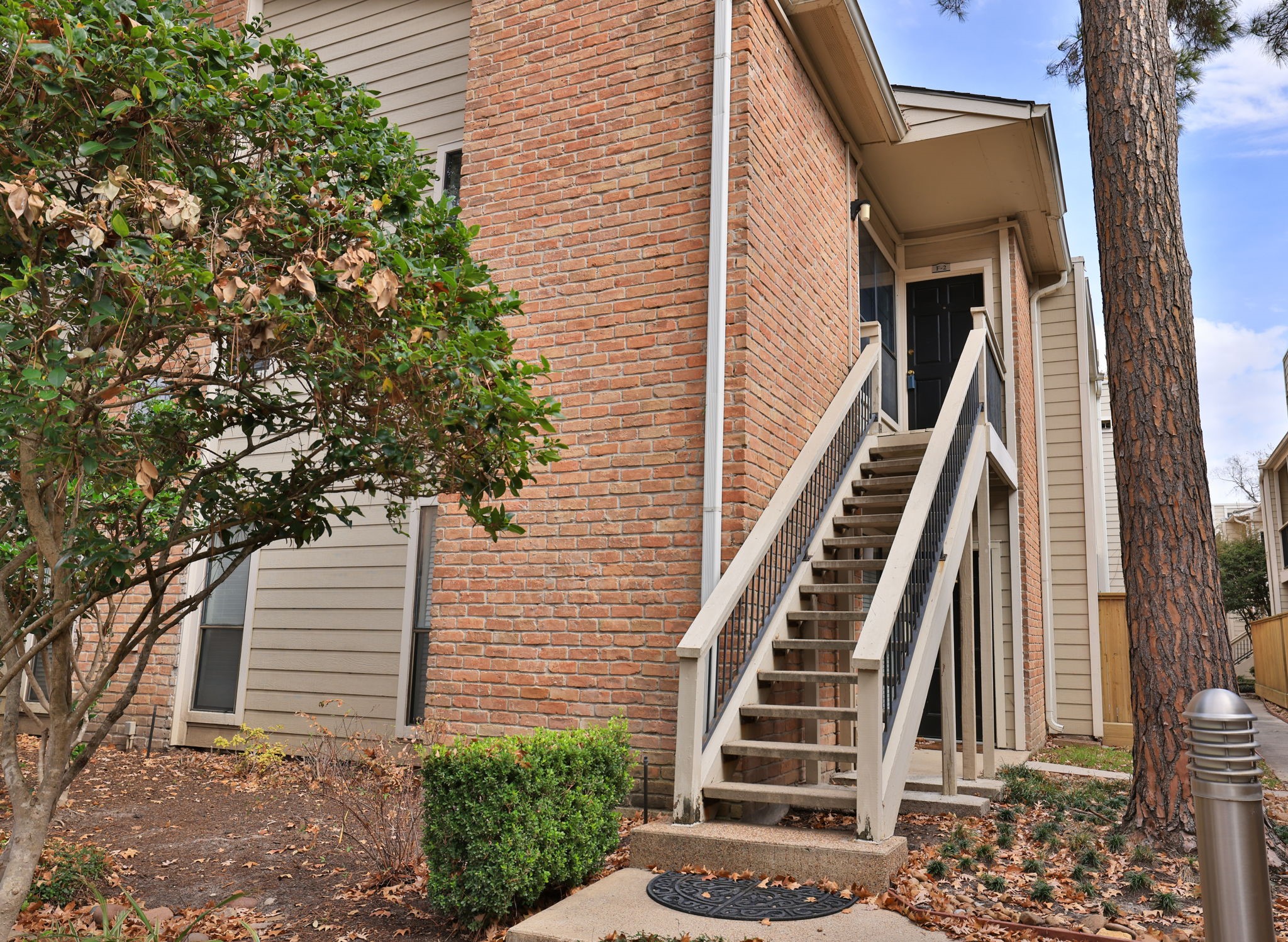 2001 Bering Drive, Unit 2F Houston, TX 77057 - Photo 26 of 32 a view of an entryway with staircase