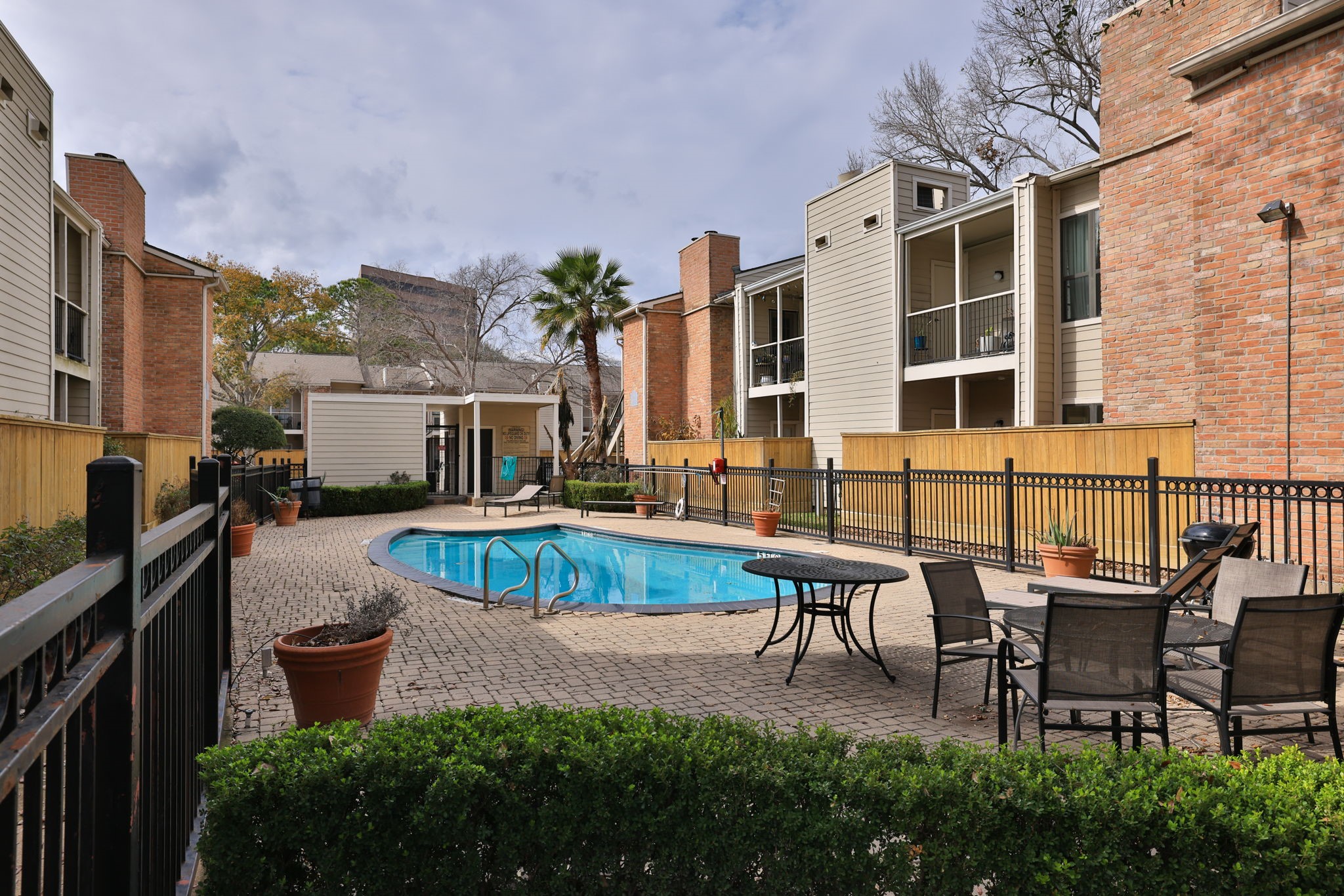 2001 Bering Drive, Unit 2F Houston, TX 77057 - Photo 30 of 32 a swimming pool with outdoor seating and yard