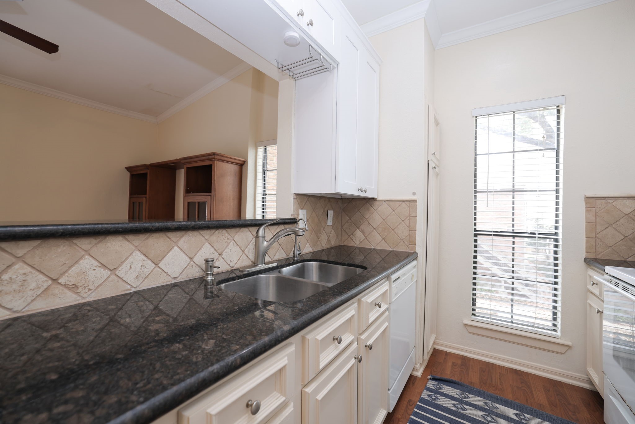 2001 Bering Drive, Unit 2F Houston, TX 77057 - Photo 8 of 32 a kitchen with granite countertop a sink and a stove top oven