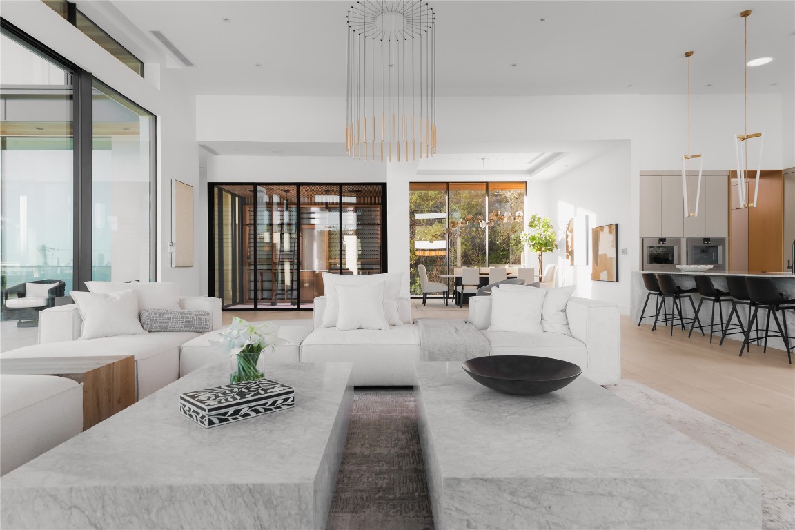 1003 The High Road Austin, TX 78746 - Photo 11 of 40 a living room with furniture a rug and a large window