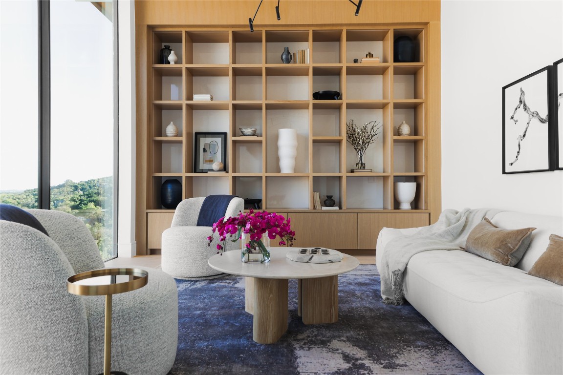 1003 The High Road Austin, TX 78746 - Photo 14 of 40 a living room with furniture and a rug