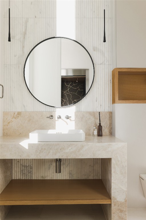 1003 The High Road Austin, TX 78746 - Photo 15 of 40 a bathroom with a sink and a mirror