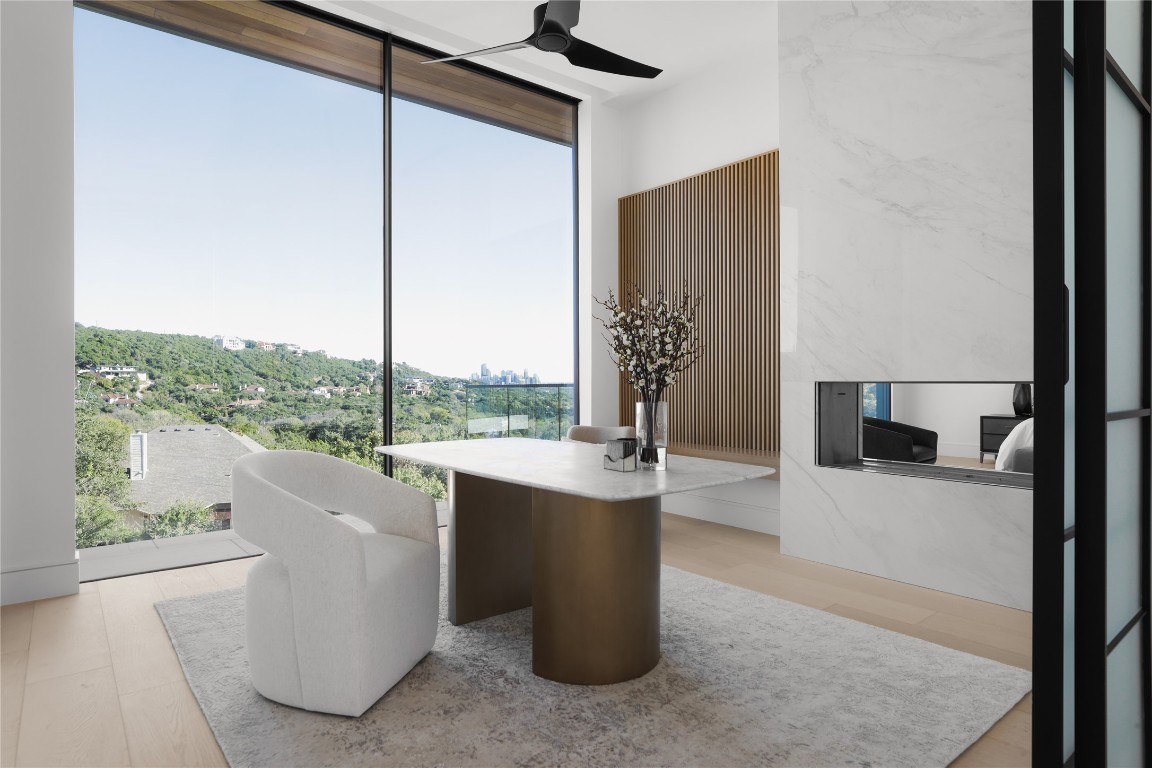 1003 The High Road Austin, TX 78746 - Photo 17 of 40 a living room with furniture and a large window