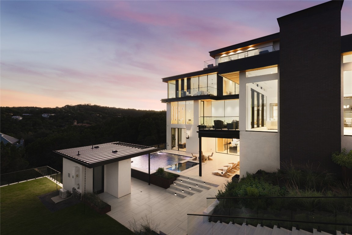 1003 The High Road Austin, TX 78746 - Photo 23 of 40 a picture of a building with a yard