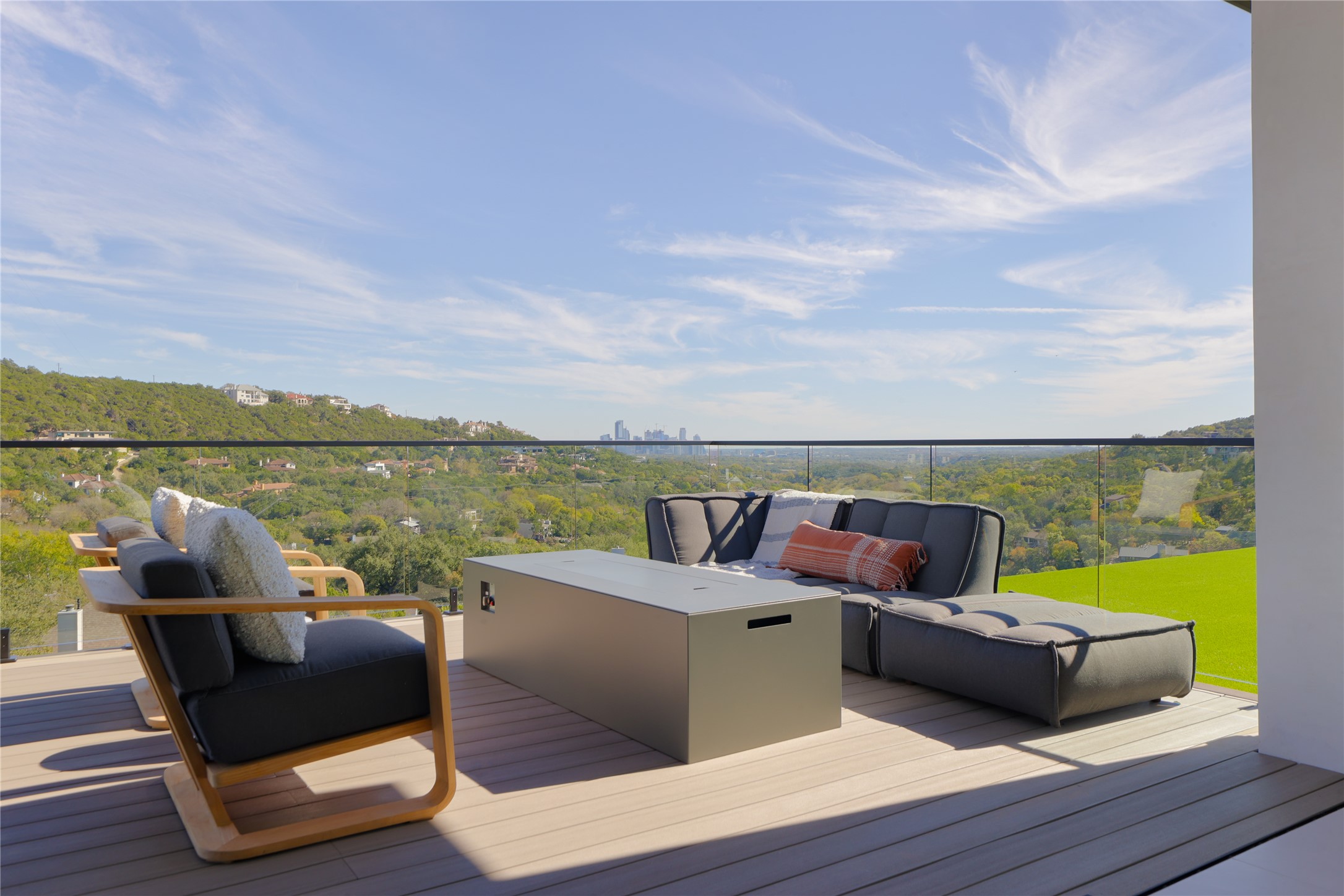 1003 The High Road Austin, TX 78746 - Photo 25 of 40 a roof deck with a table and chairs