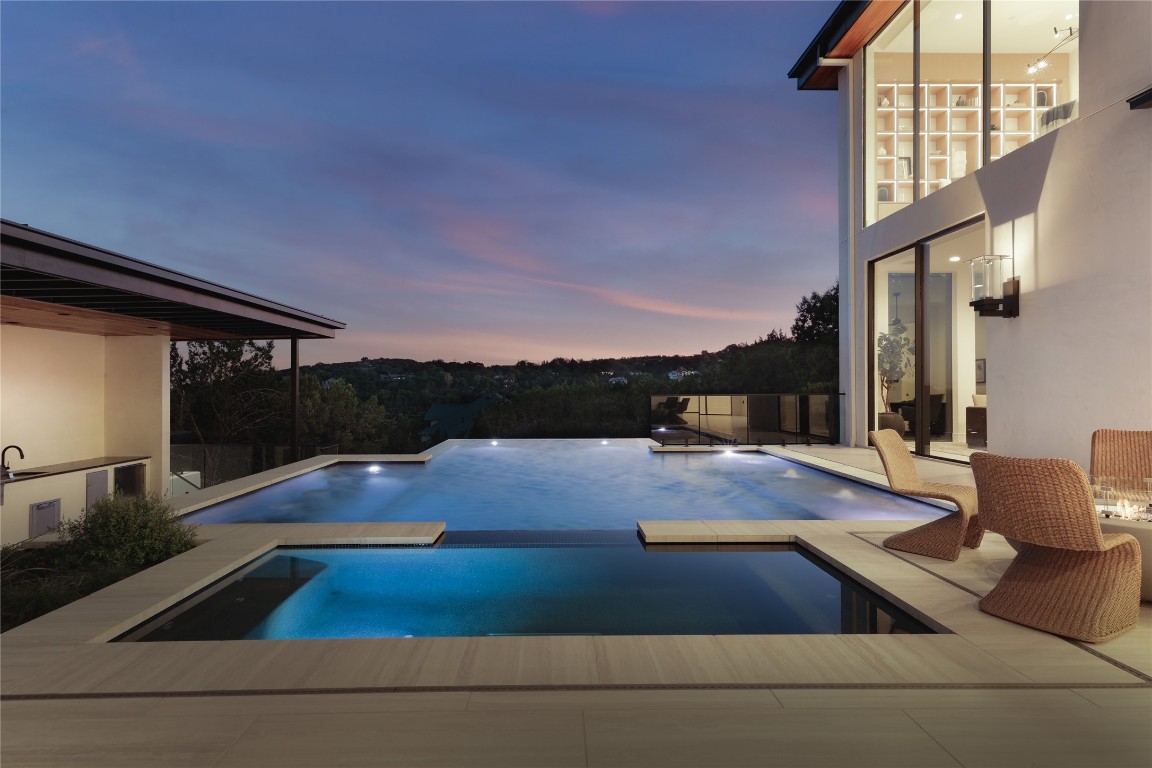 1003 The High Road Austin, TX 78746 - Photo 27 of 40 a view of swimming pool with patio