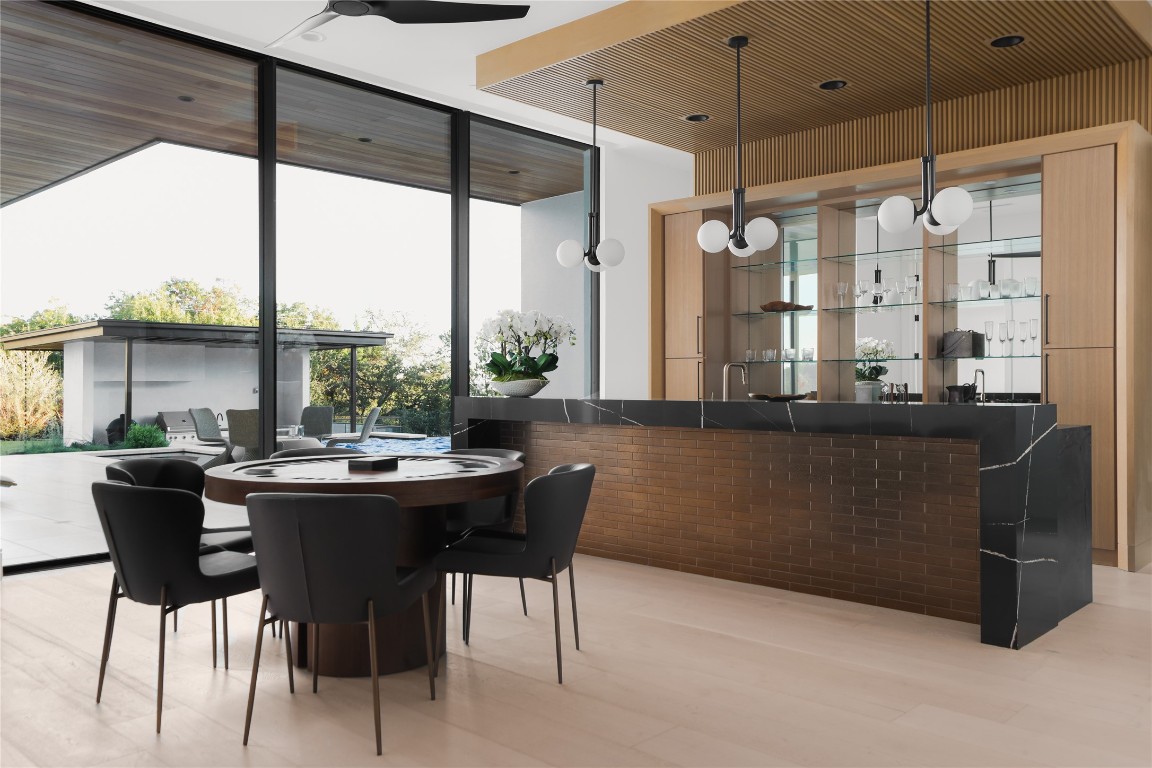1003 The High Road Austin, TX 78746 - Photo 29 of 40 a dining room with furniture and window