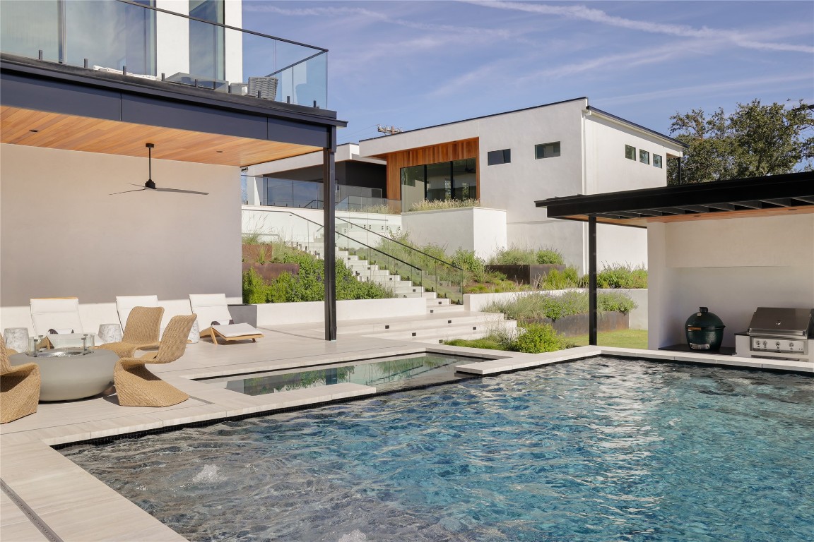 1003 The High Road Austin, TX 78746 - Photo 35 of 40 a large building with a view of the patio