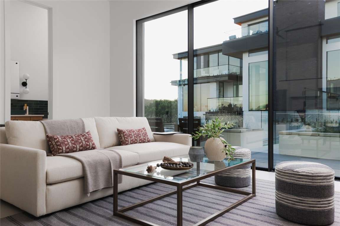 1003 The High Road Austin, TX 78746 - Photo 37 of 40 a living room with furniture and a fireplace