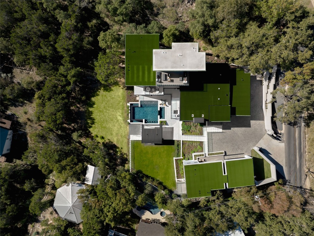 1003 The High Road Austin, TX 78746 - Photo 7 of 40 an aerial view of a house with outdoor space