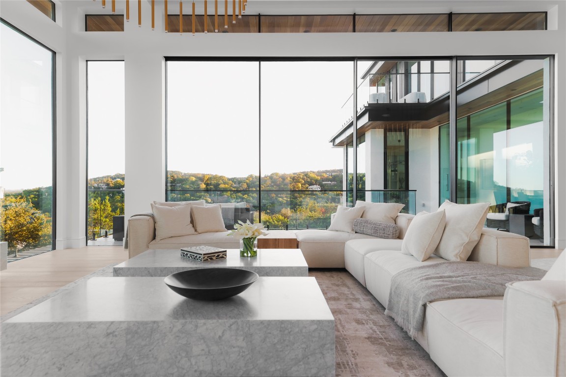 1003 The High Road Austin, TX 78746 - Photo 9 of 40 a living room with furniture and a large window