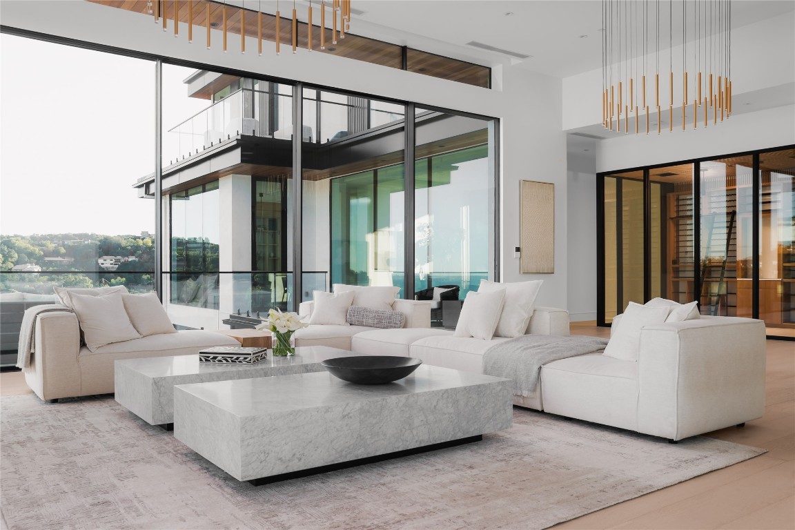 1003 The High Road Austin, TX 78746 - Photo 10 of 40 a living room with furniture and a large window