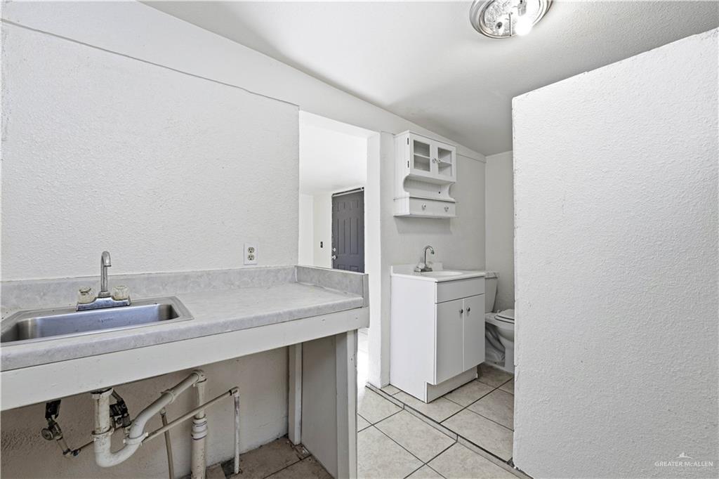 8516 Hendrix Avenue, Unit 3 Edinburg, TX 78542 - Photo 5 of 6 a bathroom with a sink toilet and shower
