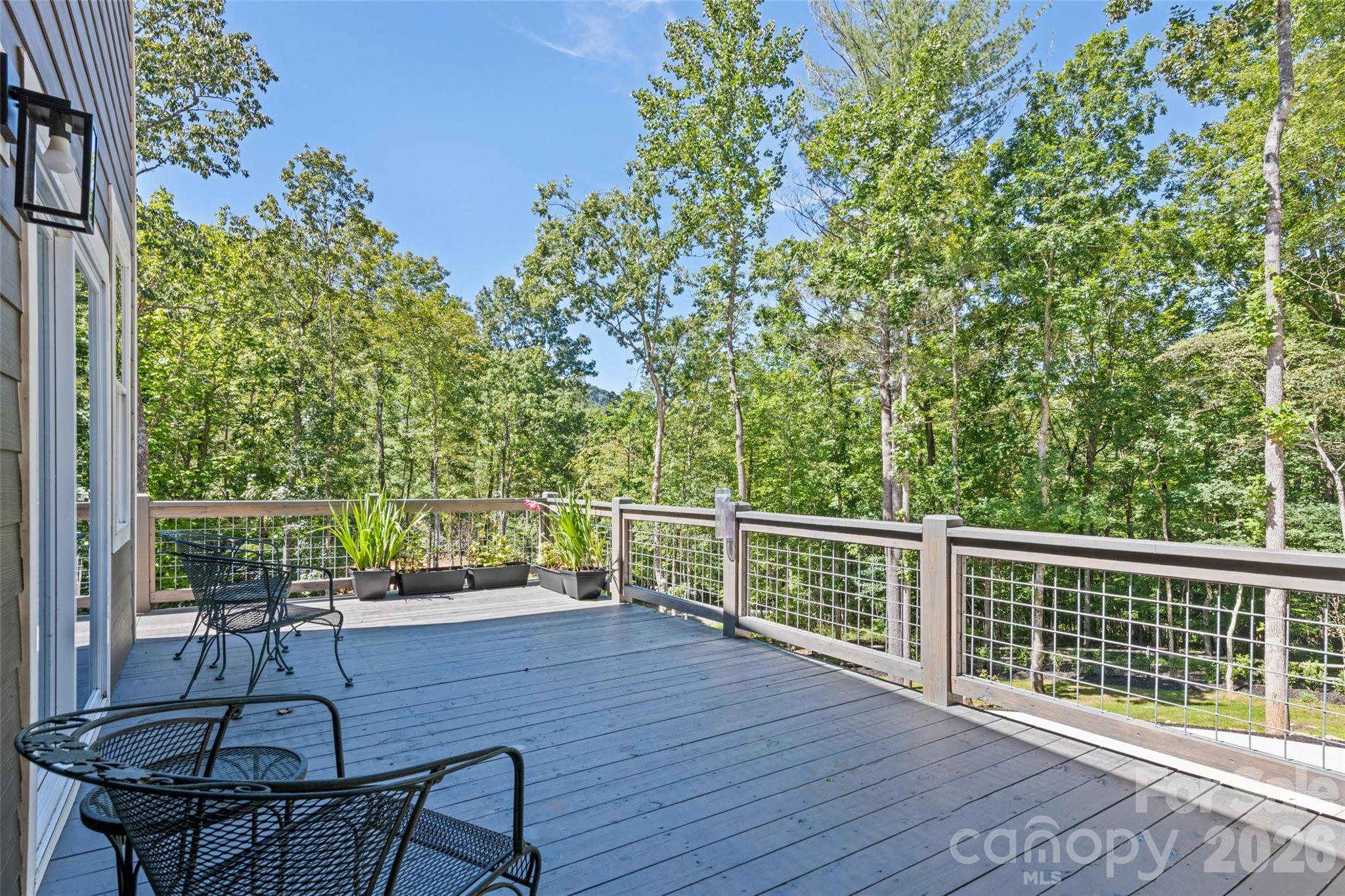 1185 Wallalieu Road Otto, NC 28763 - Photo 6 of 43 a deck view with a garden space