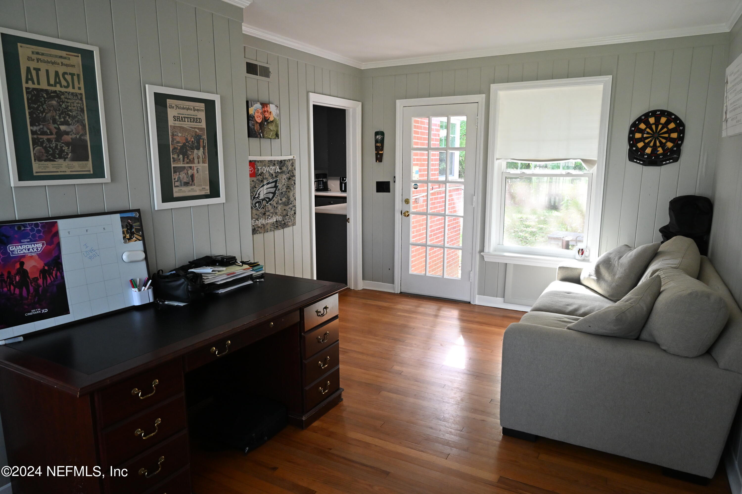 5054 Pirates Cove Road Jacksonville, FL 32210 - Photo 15 of 27 a living room with furniture window and wooden floor