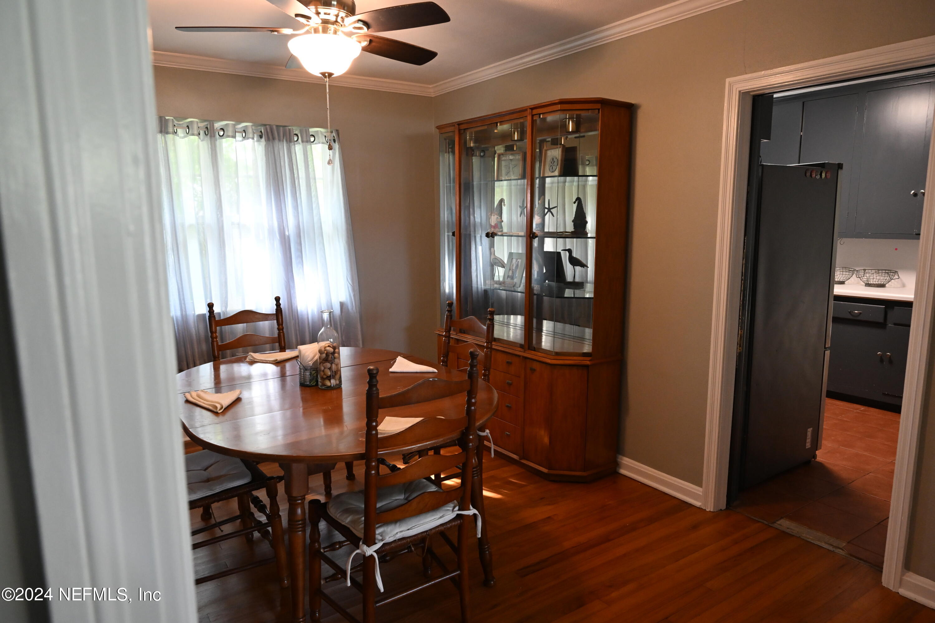 5054 Pirates Cove Road Jacksonville, FL 32210 - Photo 21 of 27 a dining room with furniture and window
